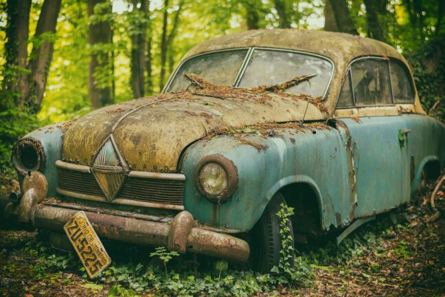 car wreck abandoned in forest