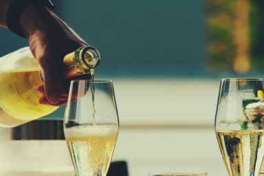 white wine poured in two glasses
