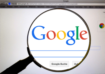 google fron page under a magnifying glass