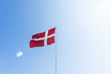 danish flag against blue sky
