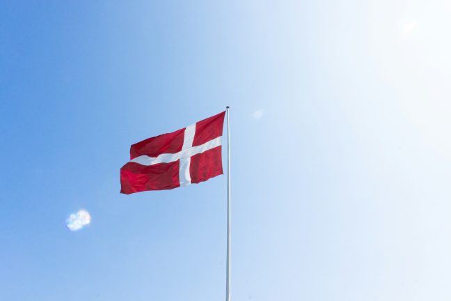 danish flag against blue sky