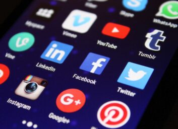 Phone screen with social media logos. Source: Pixabay