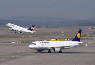 lufthansa aicraft on an airport runway