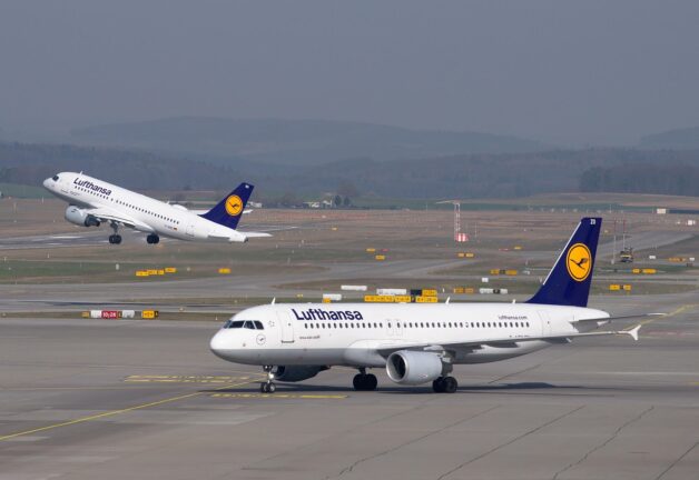 lufthansa aicraft on an airport runway