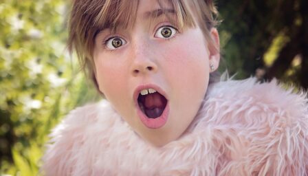 a girl pretendng to be scared