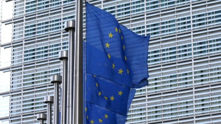 EU flags in front of the Berlaymont building, the seat of the European Commission