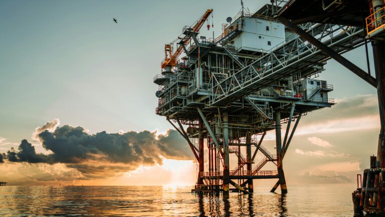 Offshore oil platform at sea under a cloudy sky
