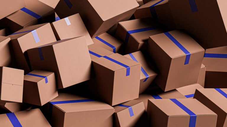 Pile of cardboard parcels sealed with blue tape
