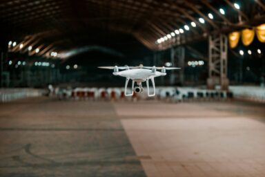 Drone flying inside a large industrial hangar