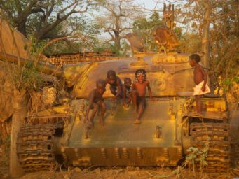black children atop a tank
