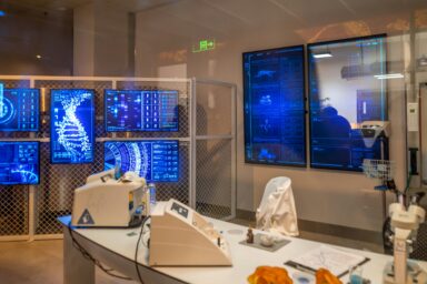 Computer screens displaying data in an office setting