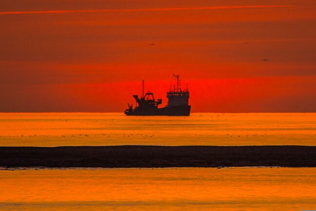 ship at sea, sunset