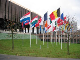 Flags of EU member states flying in front of the Court of Justice of the European Union in Luxembourg