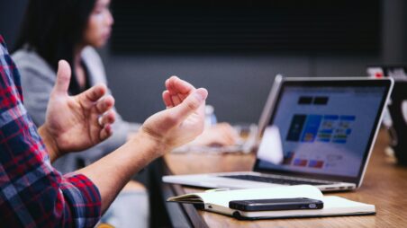 Hands gesturing during a business meeting in an office