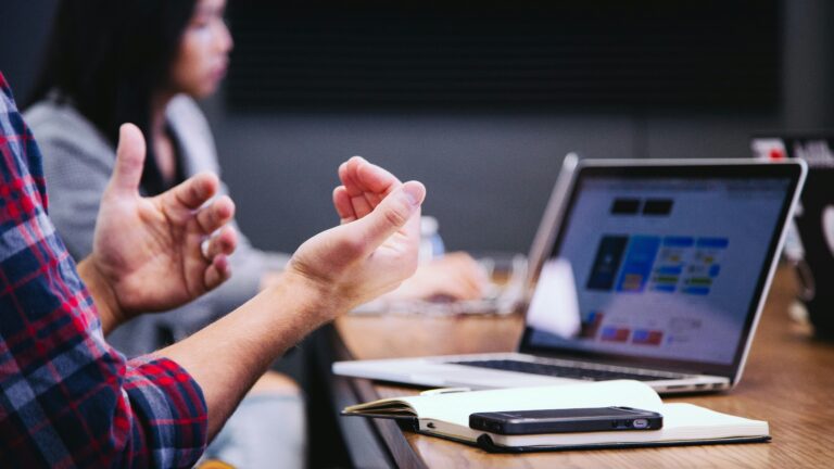 Hands gesturing during a business meeting in an office