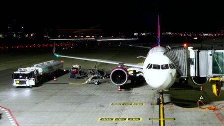 Airplane being refueled on the tarmac
