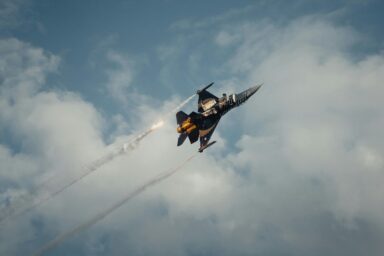 NATO fighter jet firing flares during a military exercise