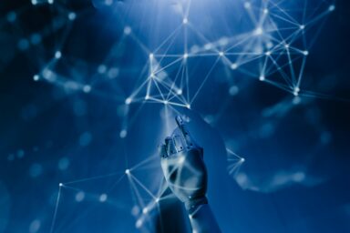 A robotic hand pointing upward toward a digital network