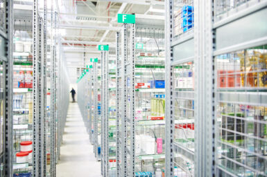 Rows of medicine shelves in a pharmaceutical warehouse