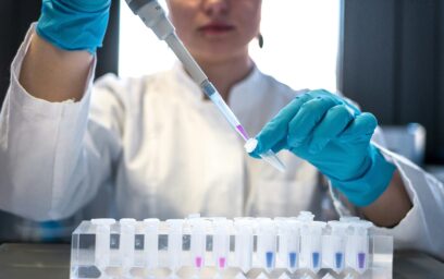 A researcher pipetting samples in a laboratory