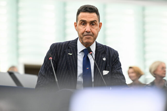 Roberto Vannacci speaking at a podium in the European Parliament