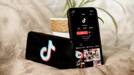 Two smartphones displaying the TikTok app