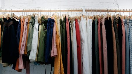 A clothing rack filled with tightly packed garments on hangers