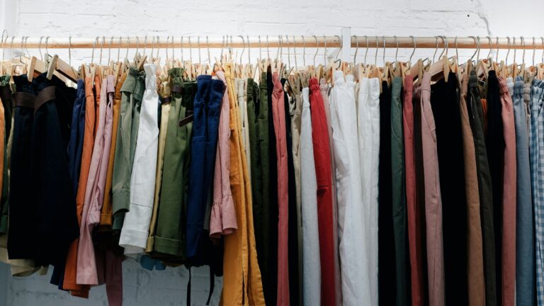 A clothing rack filled with tightly packed garments on hangers