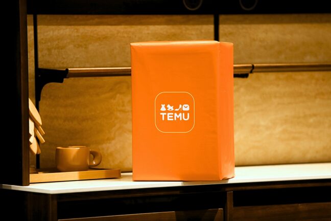 Orange Temu parcel on a shelf