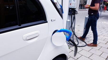 Electric vehicle connected to a charging point