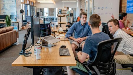 Young startup team working in an open-plan technology office