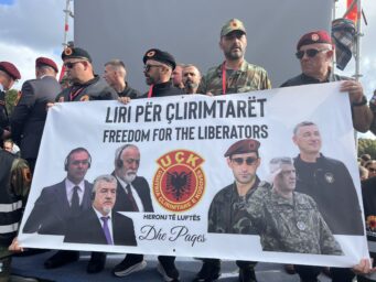 Kosovo Liberation Army veterans hold a banner reading "Freedom for the Liberators" with portraits of the four convicted men