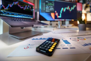 Screens showing stock market charts