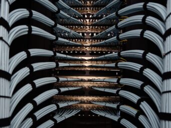Close-up of network cables and patch panels in a server rack