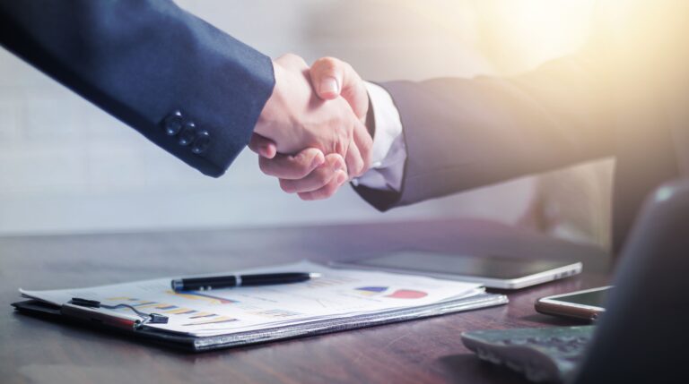Two businessmen shaking hands