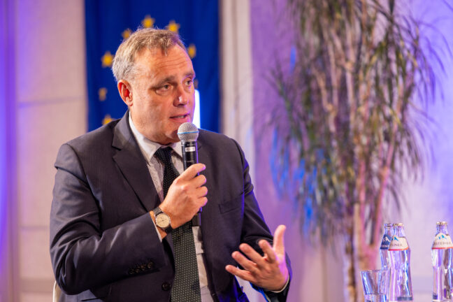 Alexander Natz, secretary general of EUCOPE, speaking into a microphone at the European Health Forum Gastein