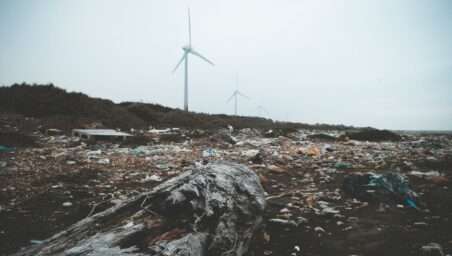 Wind turbine and garbage on a beach