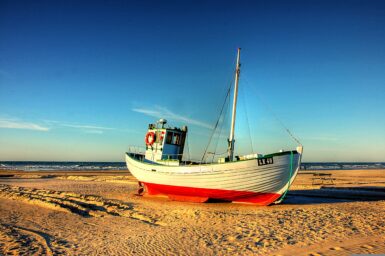 Fishing boat resting on the shore