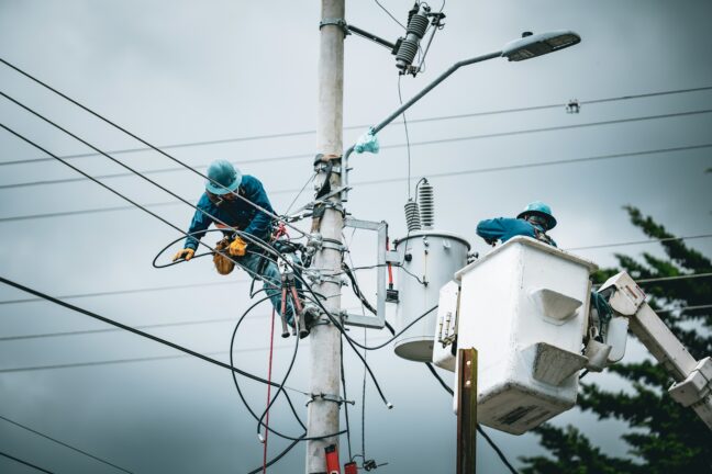 Workers on an electrical pole