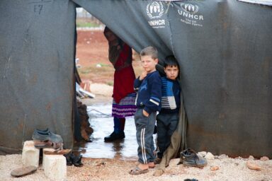 Kids in refugee agency tent